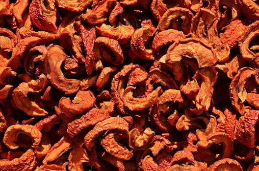 Detailed photo showcasing the texture of dried orange peels, perfect for food and texture backgrounds.